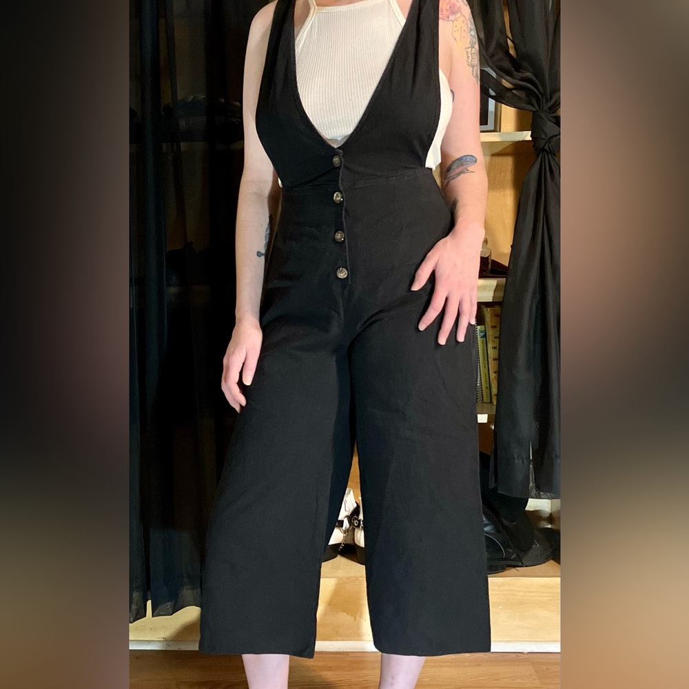 Black overall jumpsuit.